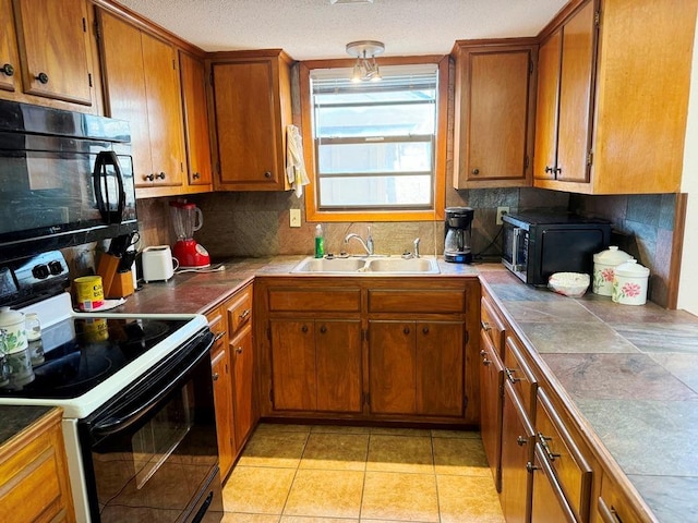 kitchen with range with electric cooktop, black microwave, brown cabinets, and a sink