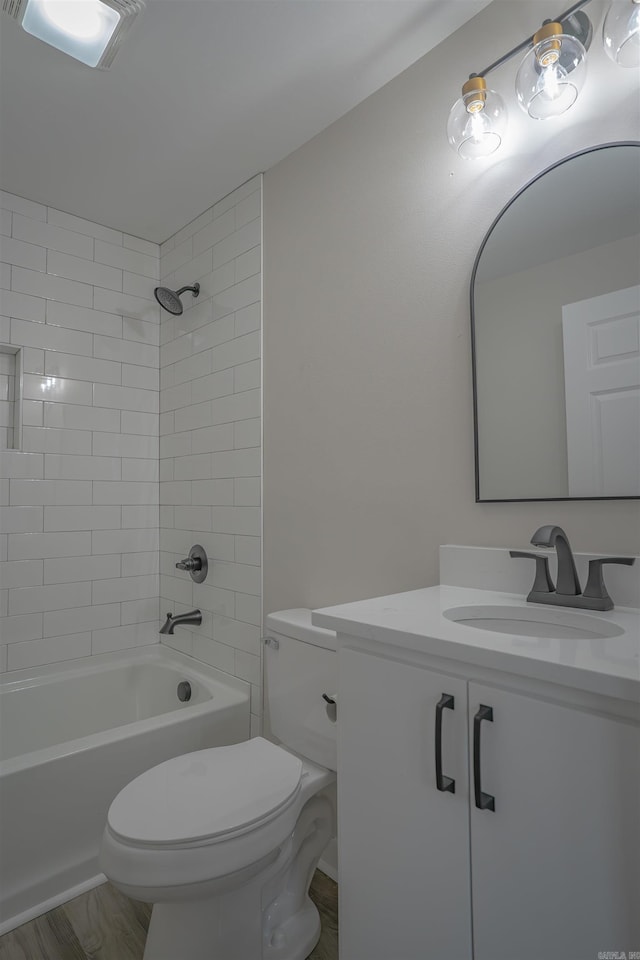 full bathroom featuring toilet, visible vents, shower / washtub combination, and vanity