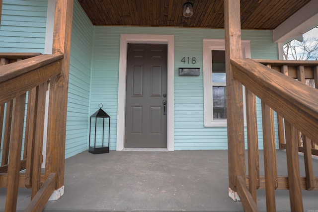 property entrance featuring covered porch