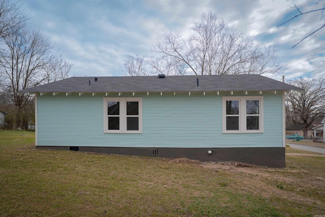 view of home's exterior featuring crawl space and a yard