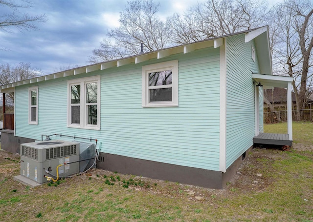 view of side of property with central AC unit