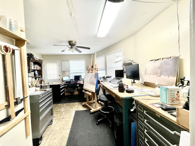 office area with a healthy amount of sunlight, ceiling fan, and light tile patterned floors