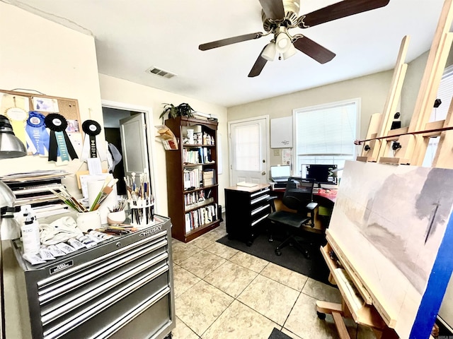 office area featuring visible vents, a ceiling fan, and light tile patterned flooring