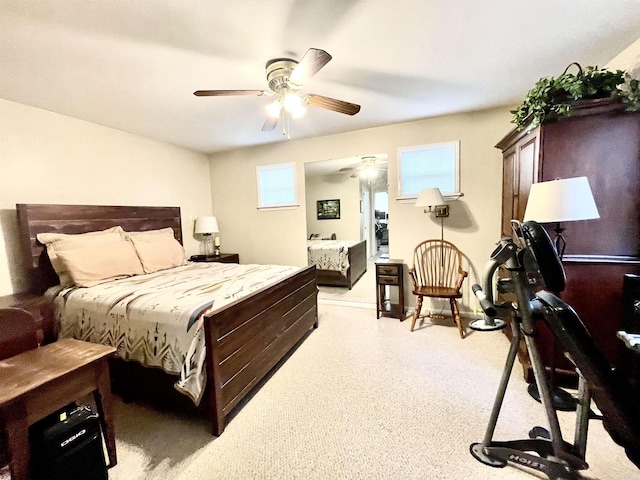 bedroom featuring multiple windows, ceiling fan, and baseboards