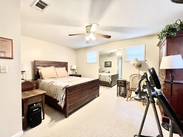 bedroom with visible vents, ceiling fan, and baseboards