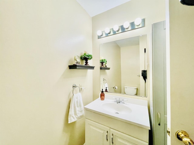 bathroom with vanity and toilet