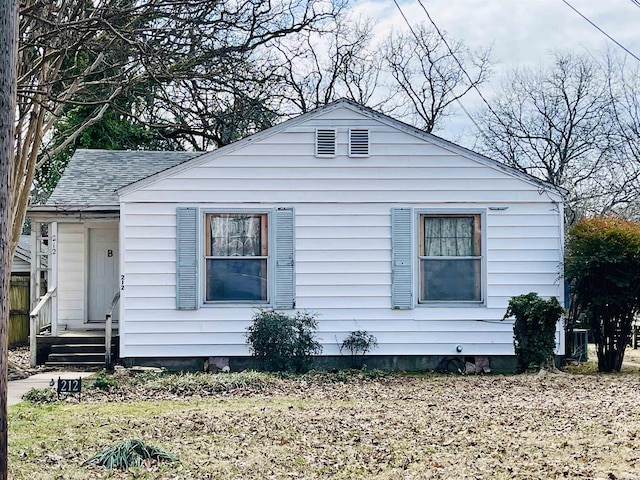 view of property exterior featuring roof with shingles