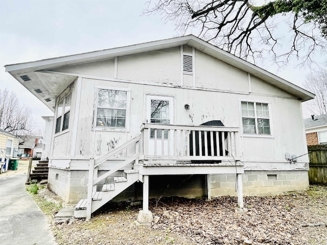 rear view of house with crawl space