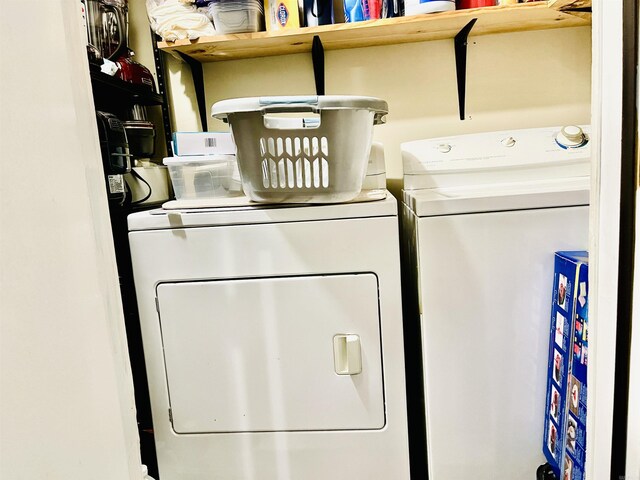 washroom with laundry area and washing machine and clothes dryer