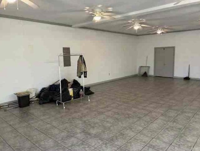 interior space featuring ceiling fan and baseboards