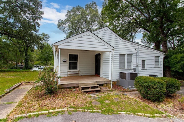 view of front of house with central AC and a porch