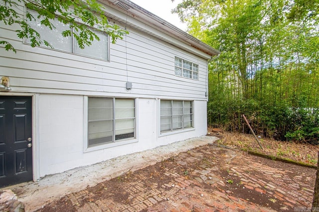 view of side of property featuring a patio