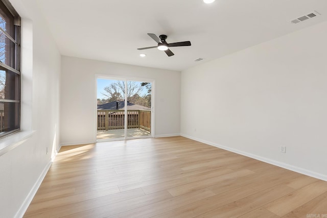 unfurnished room featuring recessed lighting, visible vents, a ceiling fan, light wood-type flooring, and baseboards