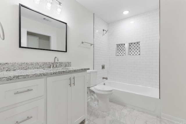 bathroom with marble finish floor, visible vents, toilet, vanity, and  shower combination