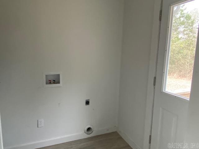 laundry room with laundry area, baseboards, wood finished floors, washer hookup, and electric dryer hookup