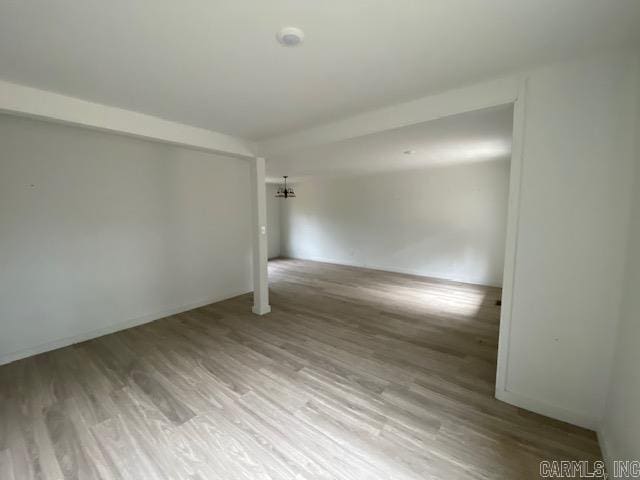 spare room featuring wood finished floors