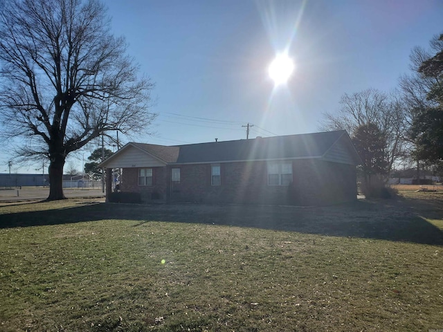 back of house with a yard