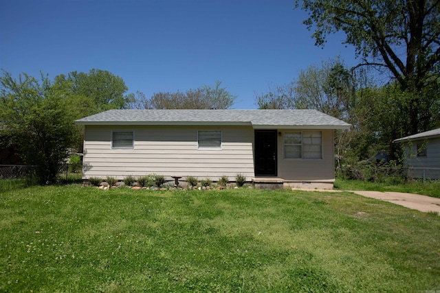 ranch-style home with crawl space, fence, and a front lawn