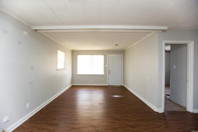 empty room with baseboards and dark wood-style flooring