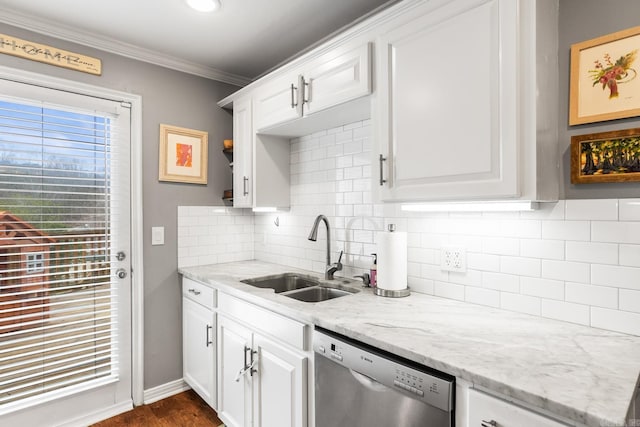 kitchen with a sink, white cabinets, ornamental molding, backsplash, and dishwasher