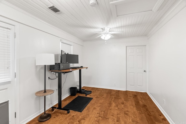 office area with baseboards, visible vents, a ceiling fan, ornamental molding, and wood finished floors