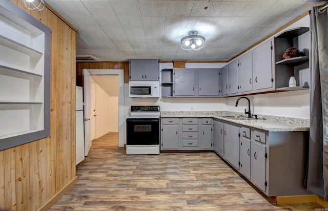 1612 Ridge Rd, El Paso, AR 72045 - kitchen featuring white appliances, wood walls, a sink, gray cabinets, and open shelves