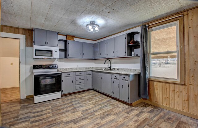 1612 Ridge Rd, El Paso, AR 72045 - kitchen featuring white microwave, a sink, gray cabinets, electric range oven, and open shelves