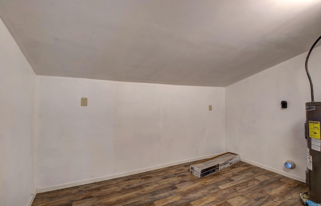 1612 Ridge Rd, El Paso, AR 72045 - additional living space featuring water heater, baseboards, vaulted ceiling, and wood finished floors