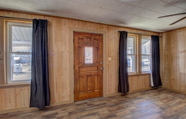 1612 Ridge Rd, El Paso, AR 72045 - foyer entrance with wood walls, ceiling fan, baseboards, and wood finished floors