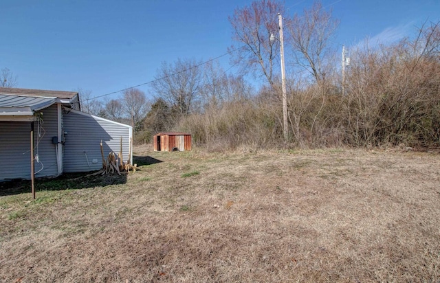 1612 Ridge Rd, El Paso, AR 72045 - view of yard featuring a shed and an outbuilding