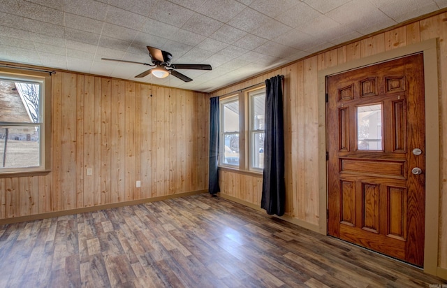 1612 Ridge Rd, El Paso, AR 72045 - entrance foyer featuring wooden walls, baseboards, and wood finished floors