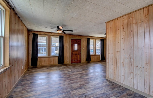 1612 Ridge Rd, El Paso, AR 72045 - foyer with ceiling fan, plenty of natural light, wood finished floors, and wooden walls