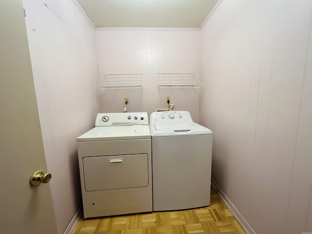 laundry room with laundry area, ornamental molding, independent washer and dryer, and baseboards