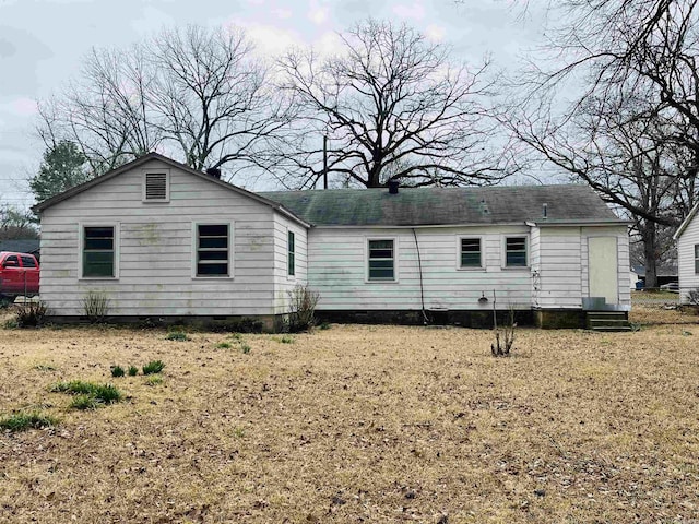 rear view of property with crawl space