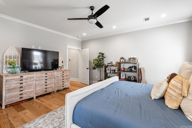 bedroom featuring visible vents, baseboards, ornamental molding, light wood-style floors, and recessed lighting