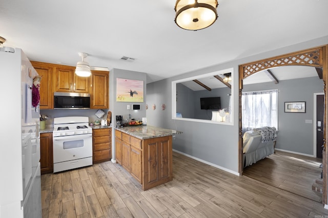 kitchen featuring a peninsula, white appliances, visible vents, brown cabinets, and light wood finished floors