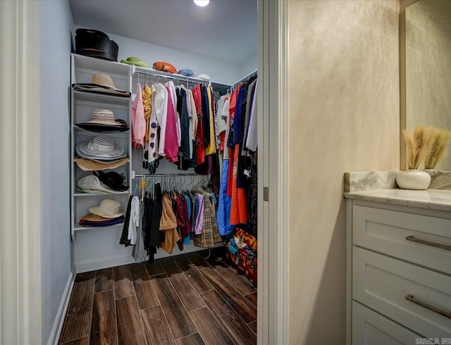 spacious closet featuring wood tiled floor