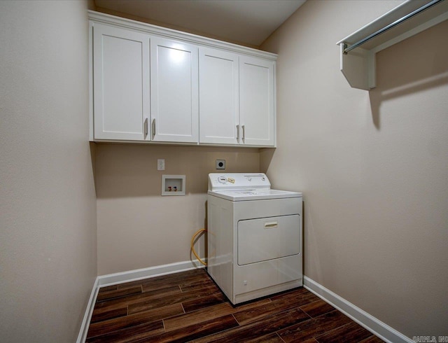 laundry room with washer / dryer, baseboards, dark wood finished floors, and cabinet space