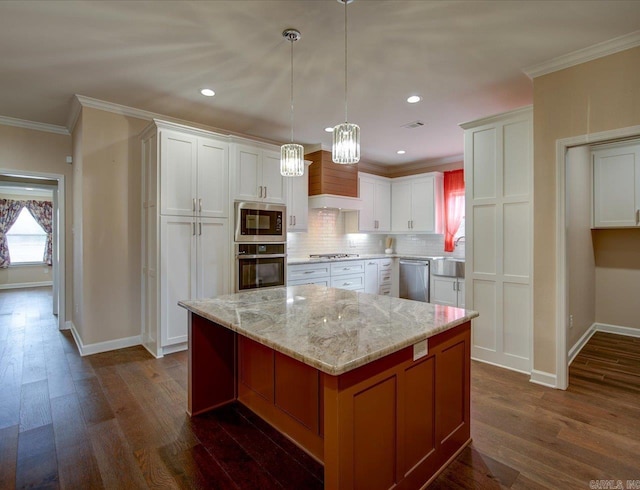 kitchen featuring dark wood-style flooring, stainless steel appliances, decorative backsplash, ornamental molding, and white cabinets