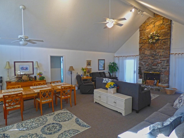 living area with high vaulted ceiling, a ceiling fan, and carpet flooring