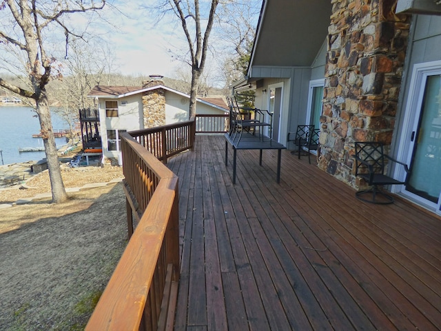 wooden deck with a water view