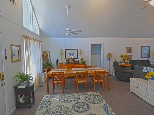 dining space featuring radiator, carpet, ceiling fan, and lofted ceiling