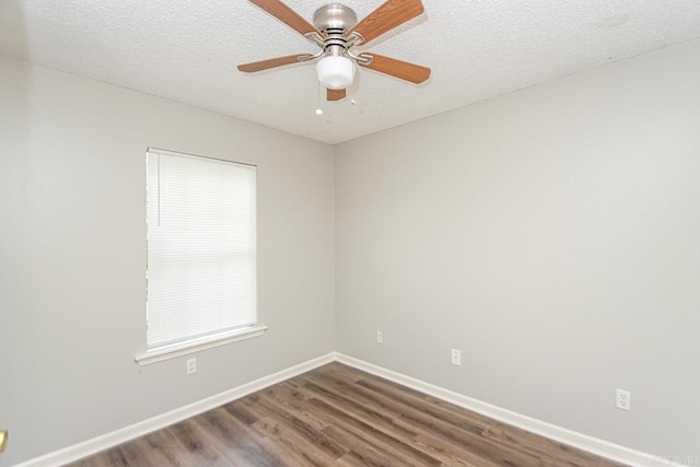 unfurnished room with a ceiling fan, a textured ceiling, baseboards, and wood finished floors