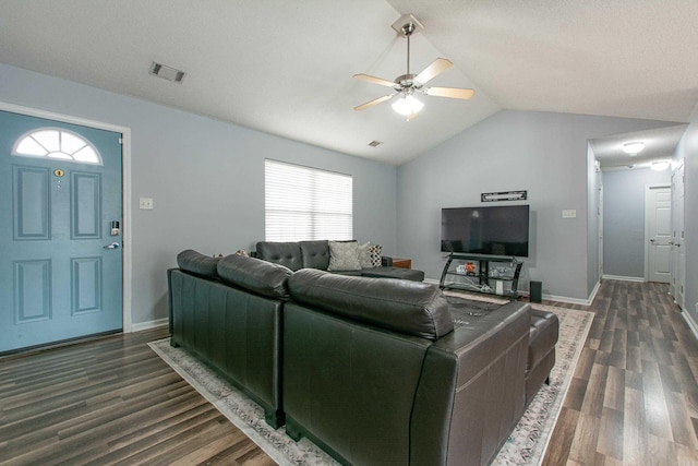 living area featuring visible vents, dark wood-type flooring, vaulted ceiling, ceiling fan, and baseboards