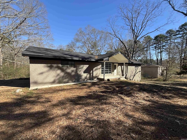 exterior space with brick siding