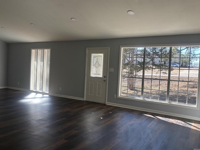 entrance foyer featuring recessed lighting, dark wood finished floors, and baseboards