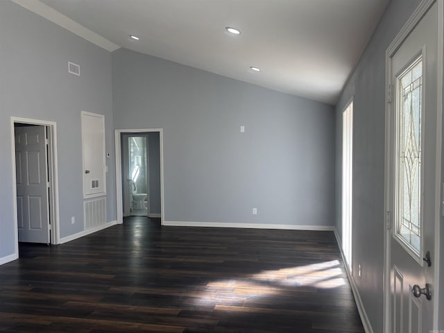 entrance foyer with dark wood-style floors, a wealth of natural light, visible vents, and baseboards