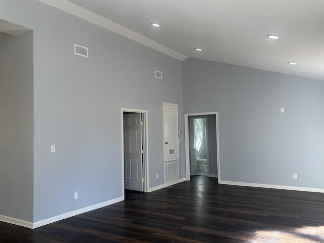 spare room with baseboards, visible vents, dark wood-type flooring, and recessed lighting