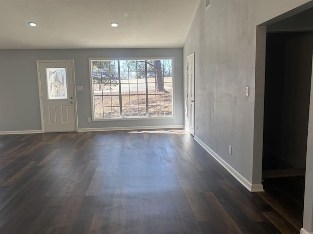 entrance foyer with baseboards, dark wood-type flooring, and recessed lighting