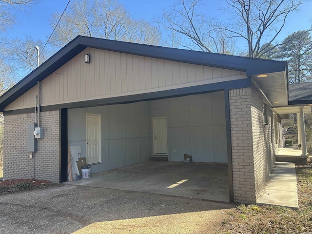 view of side of property featuring brick siding